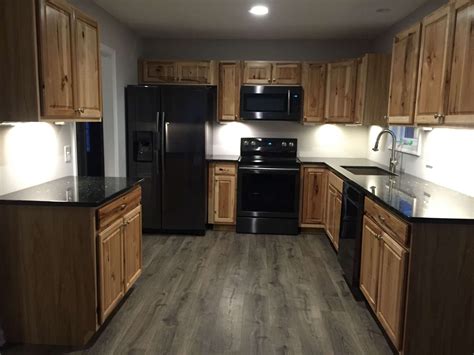 hickory cabinets with black stainless steel appliances|black stainless steel kitchen cabinets.